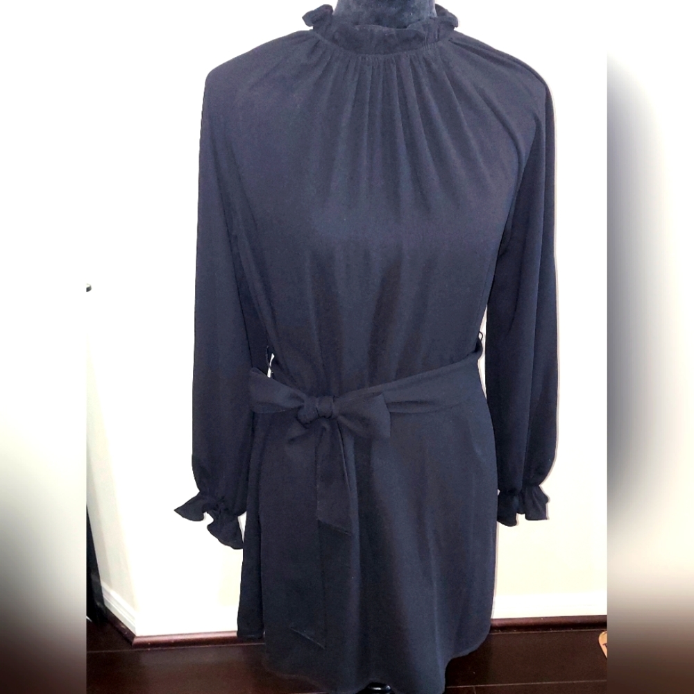 elegant black dress with long sleeves and puffed sleeves and collar